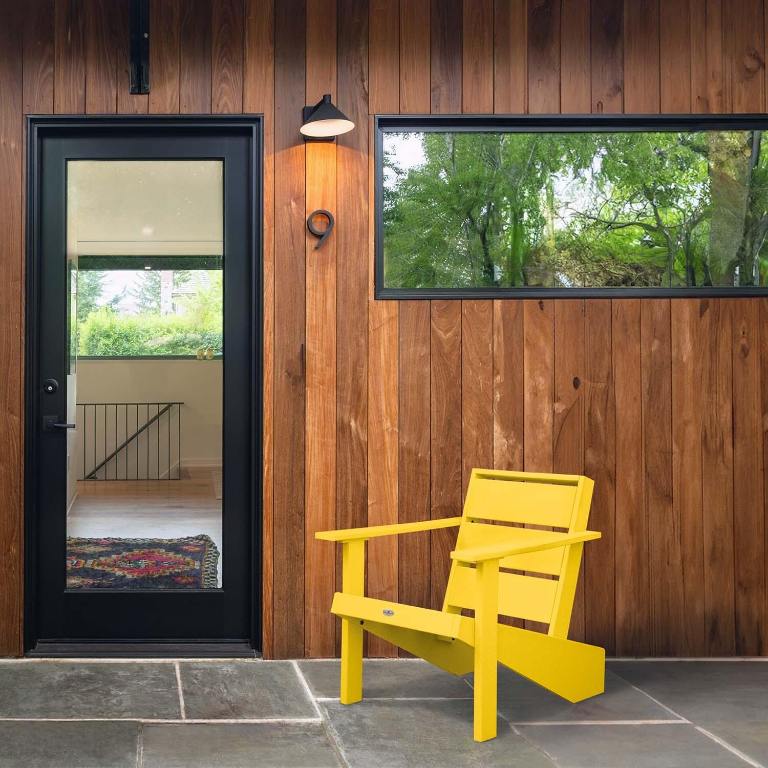 Hazel Cove Recycled Plastic Adirondack Chair in Sunbeam Yellow by Lakeview Outdoor Designs - By Door - Lifestyle thumbnail