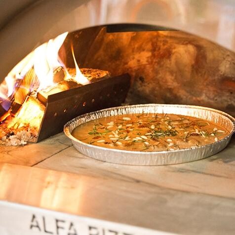 Alfa Forno Ciao Wood Burning Pizza Oven On Cart - Cooking View (Shown With Optional Wood Holder) thumbnail