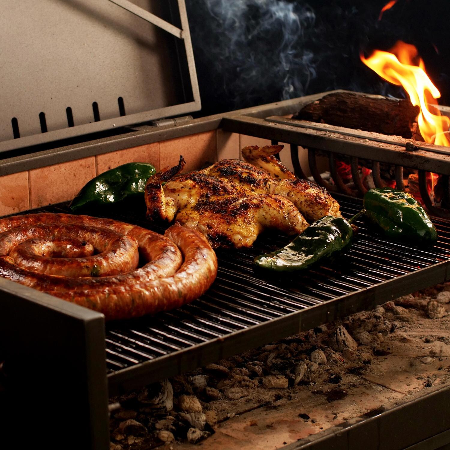 Nuke DELTACT02 47-Inch Argentinian-Style Countertop Gaucho Grill - Grilling Spatchcock Chicken & Spiral Sausage thumbnail