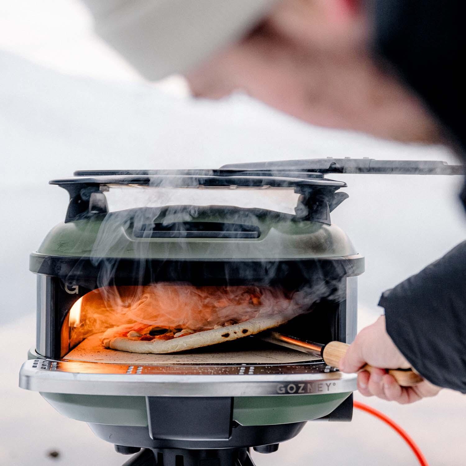 Gozney GTPOBUS1225 Black Tread Propane Pizza Oven Bundle - Included AT1965 Turning Peel - Shown w/ Olive Oven - Lifestyle thumbnail