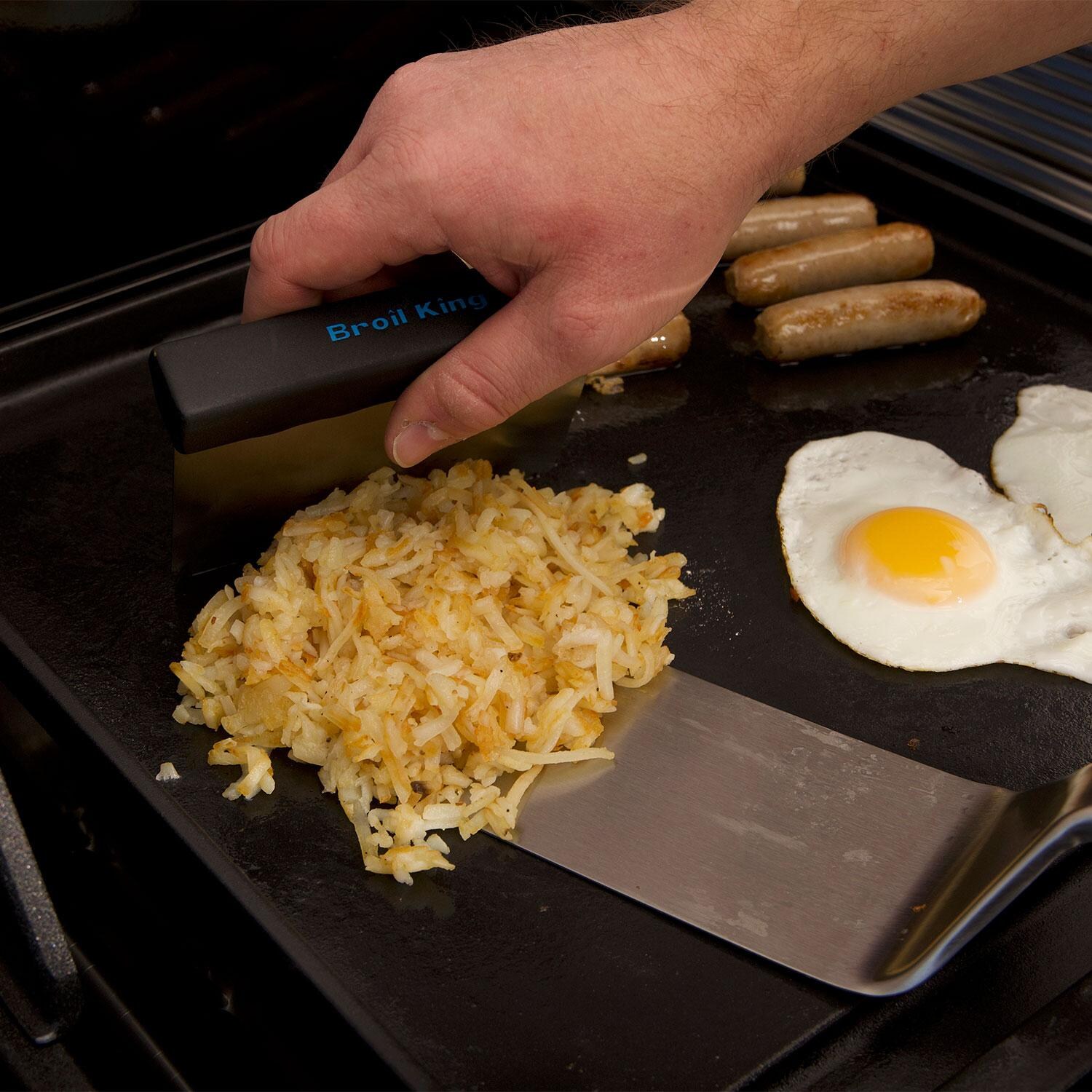 Broil King 11306 6 Pc Plancha Cooking Tool Set - Scooping Hashbrowns on Spatula w/ Scraper - Lifestyle thumbnail