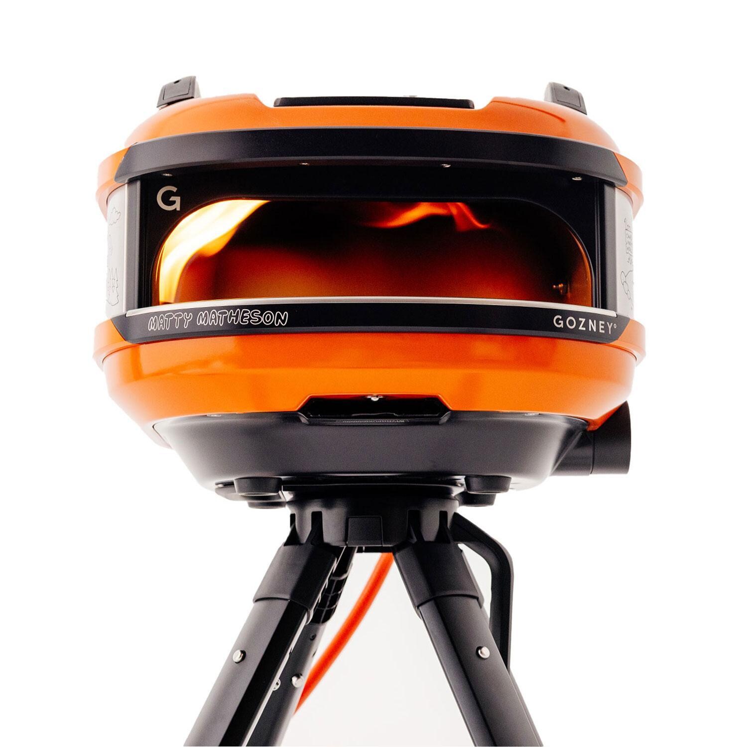 Matty Matheson x Gozney GTPOGUS1225 Limited-Edition Tread Portable Propane Pizza Oven - Orange - On Tread Stand - White Background thumbnail