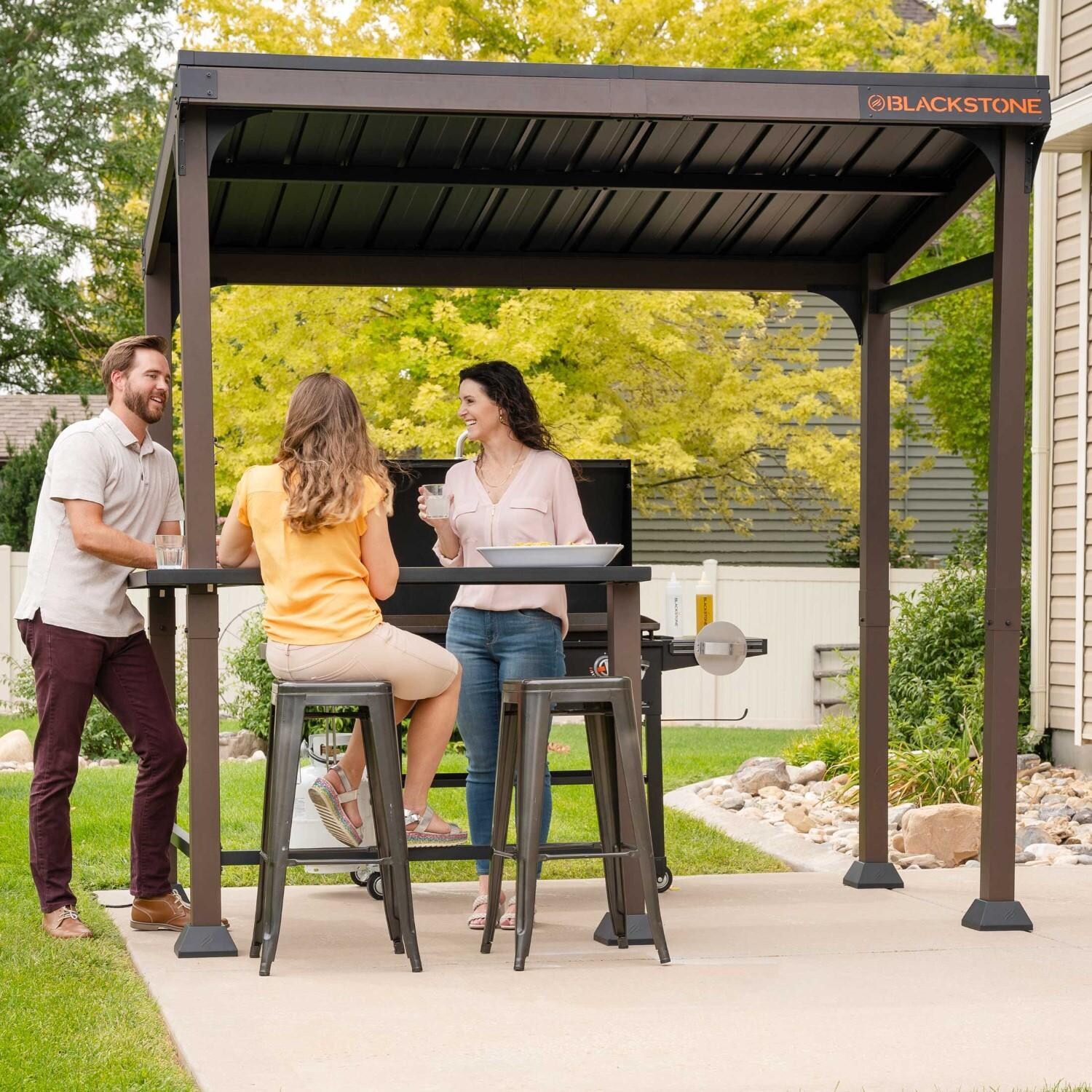 Blackstone 5 x 8-Foot Outdoor Pavilion - Friends Gathered Under Pavilion Chatting - Angled View - Lifestyle thumbnail
