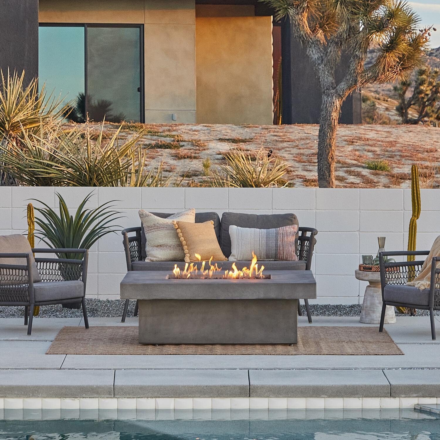 Hickory Bay 3708NG-SMK 60 Inch Rectangular GFRC Natural Gas Fire Pit Table in Smoke by BBQGuys Signature - Patio - Lifestyle thumbnail