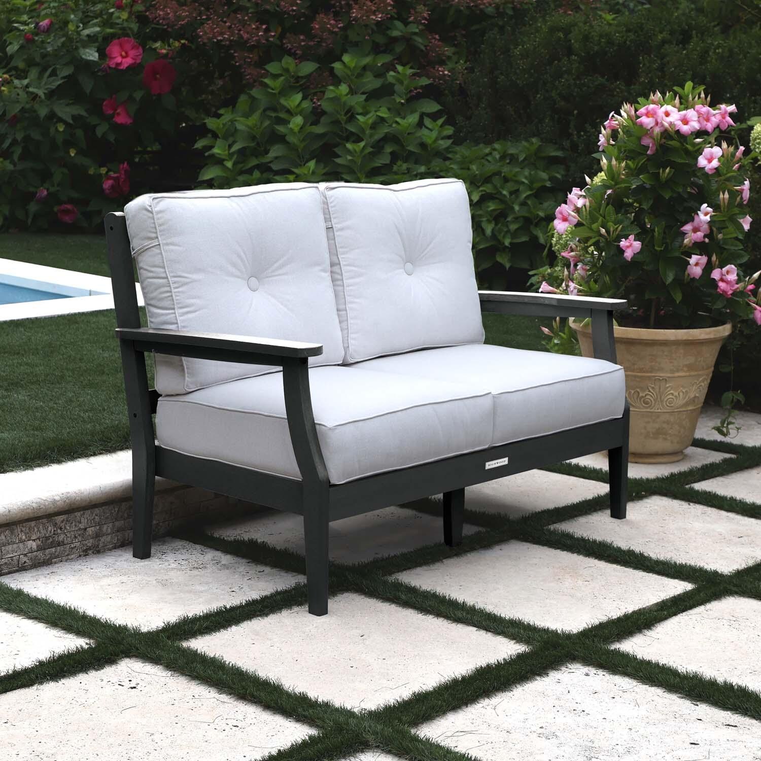 Blushing Bay 2 Person Recycled Plastic Loveseat in Bliss Linen/Black by Lakeview Outdoor Designs - Left Angled - Lifestyle thumbnail