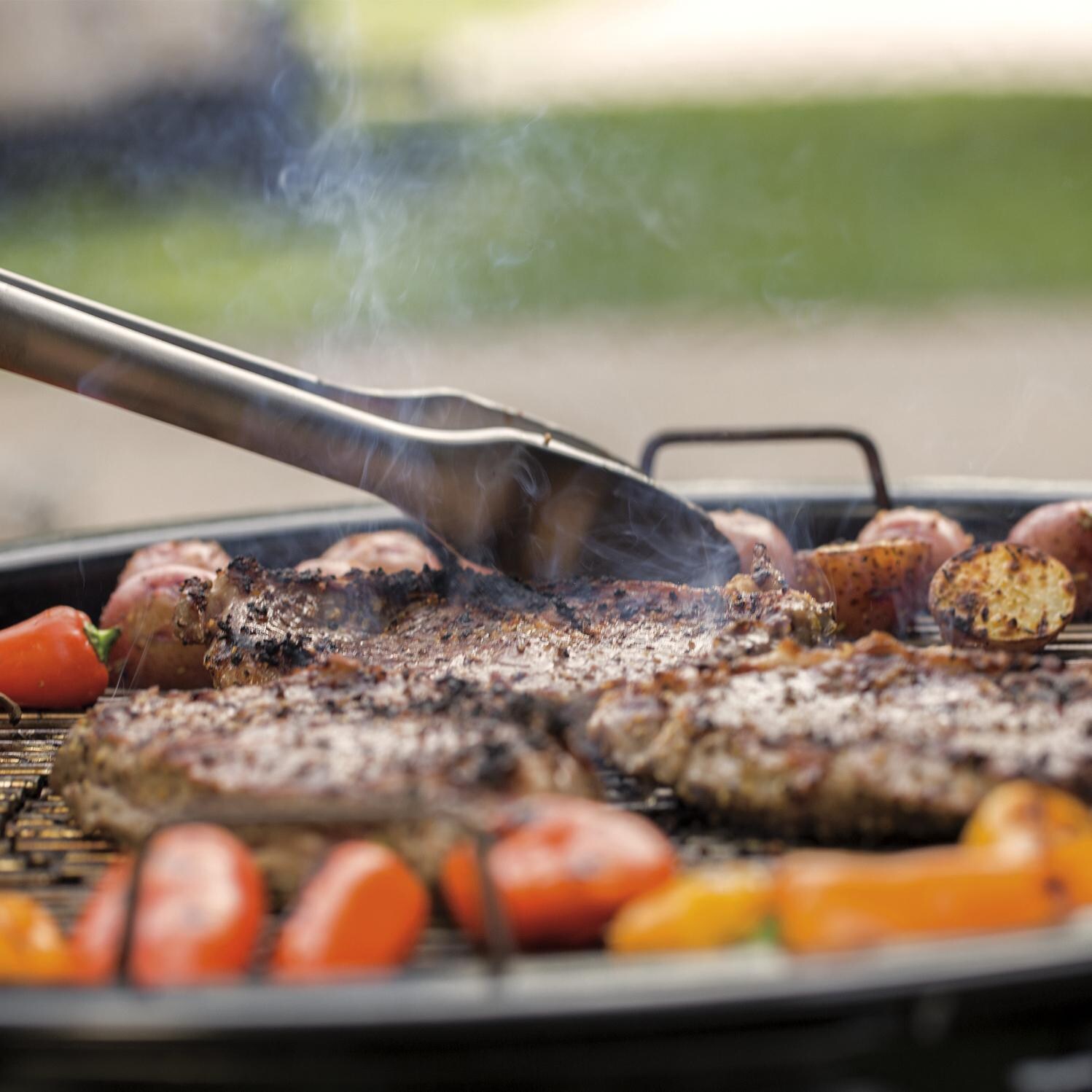 Weber Summit 24-Inch Charcoal Center BBQ Grill - Grilling Steaks thumbnail