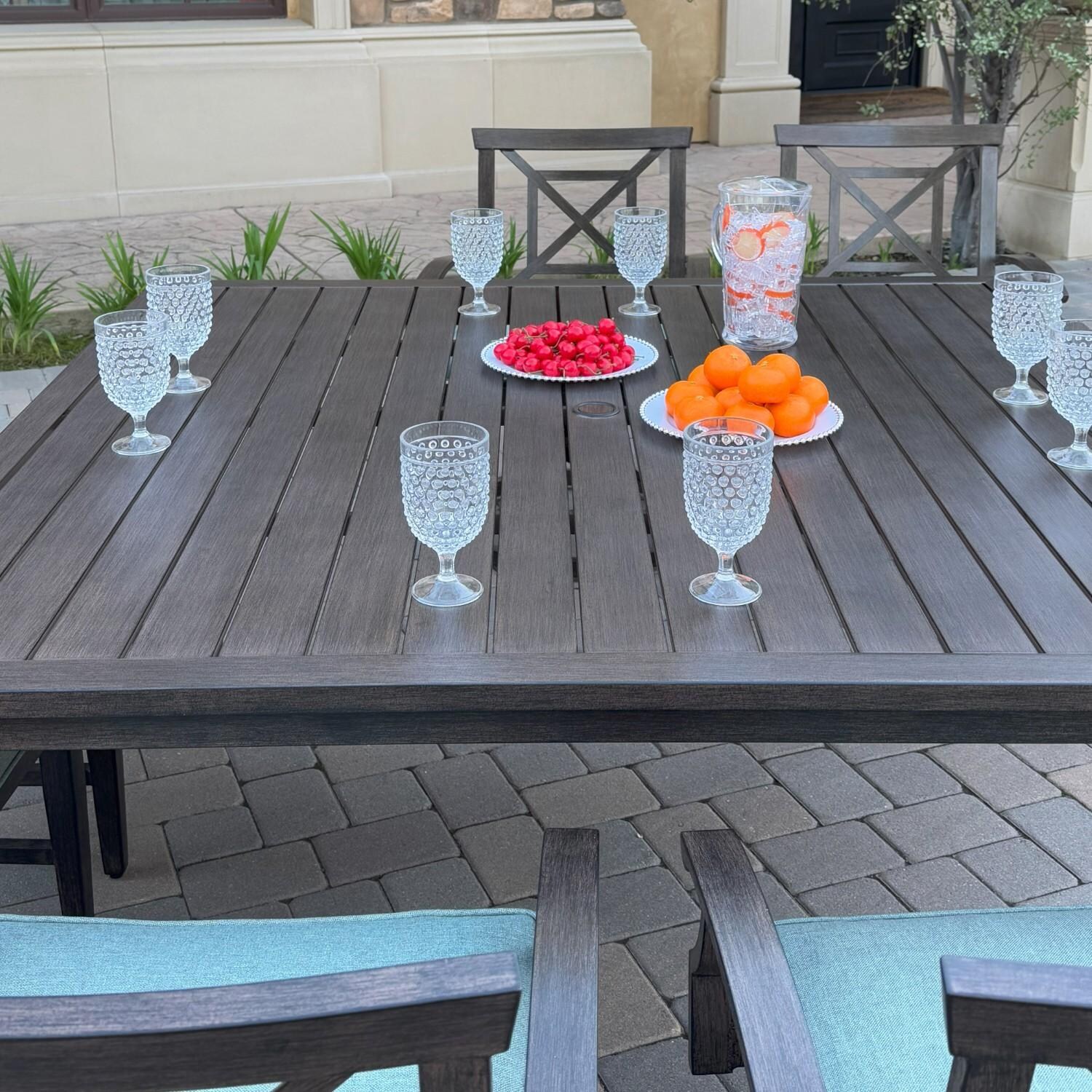 Atlantis 8 Pc Aluminum Dining Set w/ 2 Dining Side Chairs, 4 Swivel Rocker Dining Arm Chairs & Two Person Bench in Walnut/Spa by Darlee - Table Top - Lifestyle thumbnail