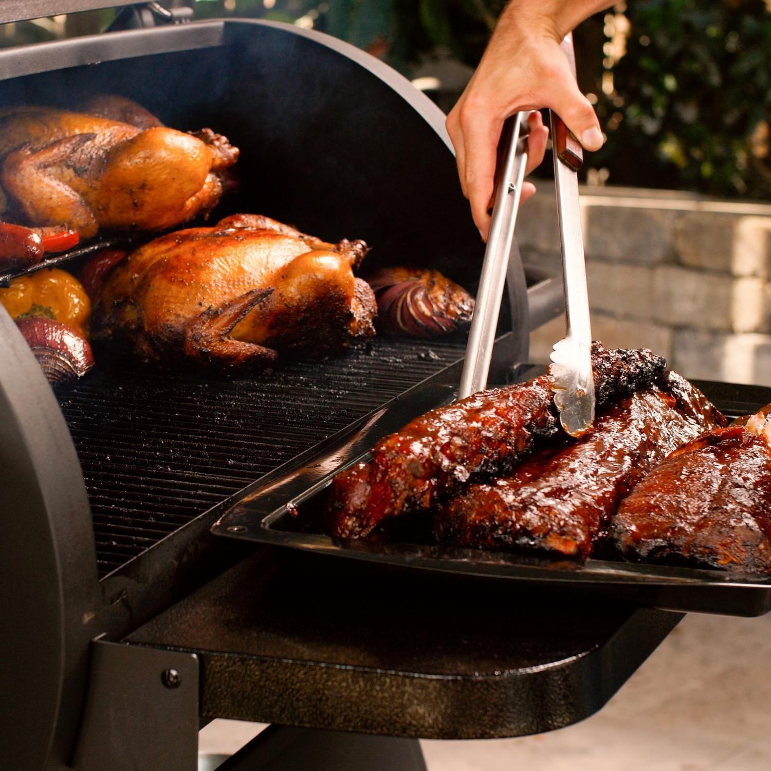 Victory BBQ-PG + BBQ-PG-CVR + BBQ-PLT20-HK + BBQ-PLT20-MQ + BBQ-PLT20-AP 35-Inch Wood Pellet Grill, Cover, & 20 Lb. Hardwood Pellets Ultimate Starter Pack - Getting Ready to Serve - Lifestyle thumbnail