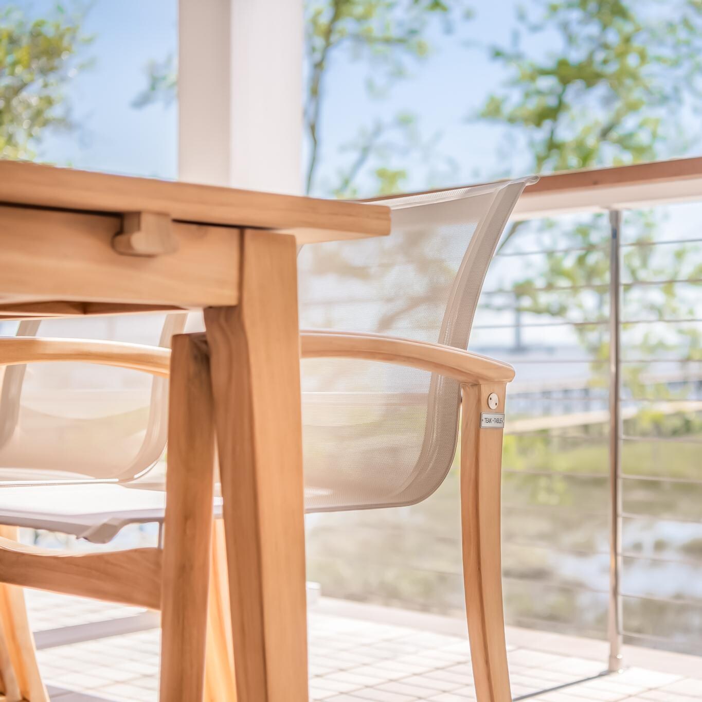 Teak + Table Capri Sling Dining Chair in Grey - Side Detail - Lifestyle thumbnail