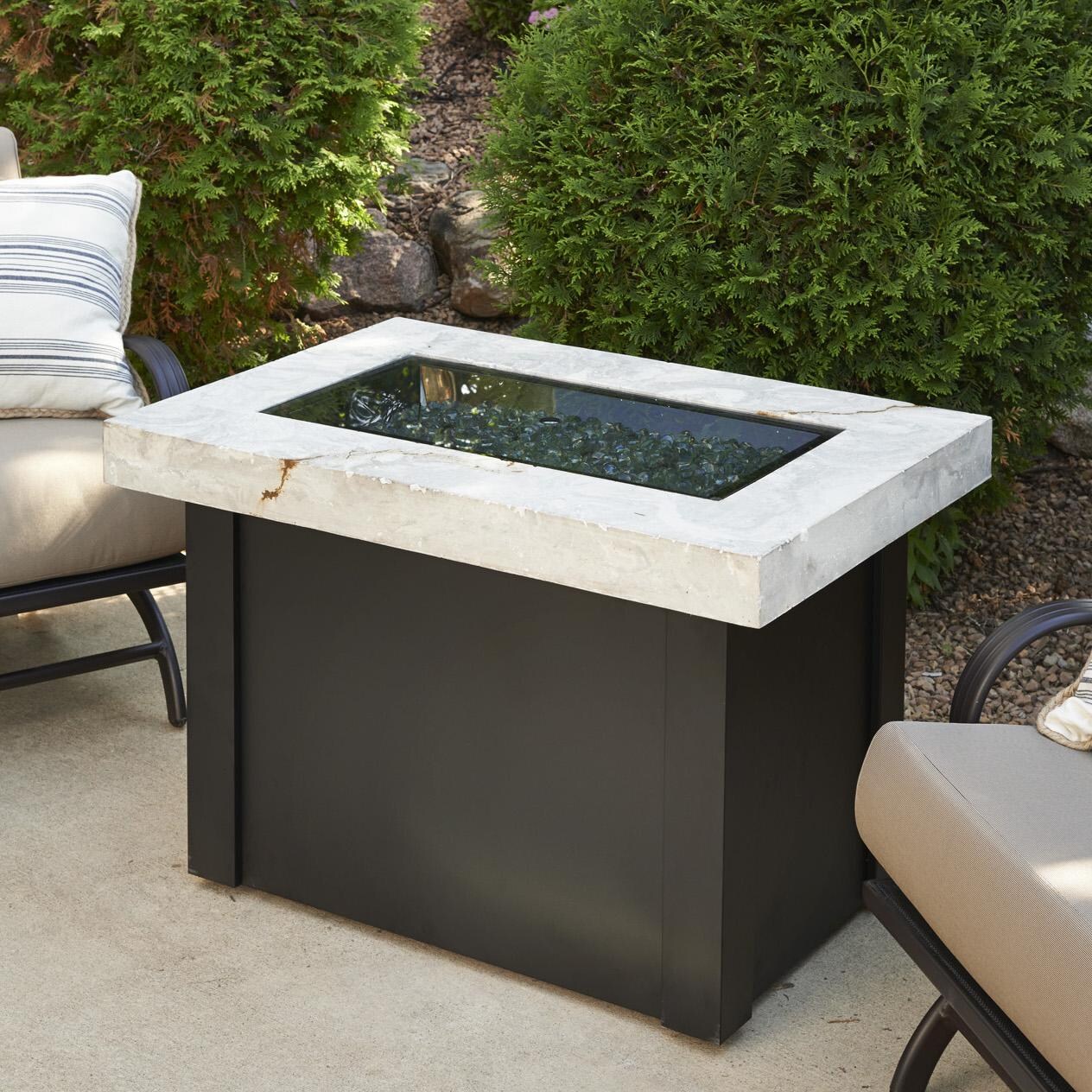 The Outdoor GreatRoom Company Providence Rectangular Gas Fire Pit Table - Lifestyle - Includes grey glass burner cover thumbnail