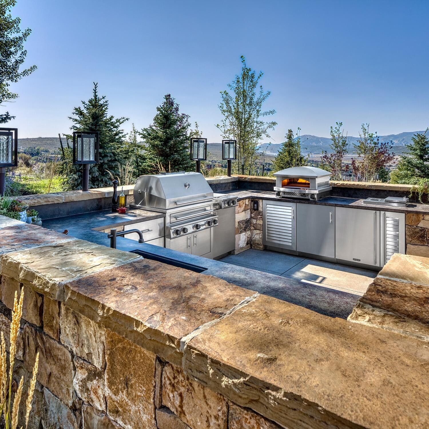 Kalamazoo K750HB Built-In Hybrid Fire Grill - Natural Gas - In Outdoor Kitchen w/ CKTPD Cooktop, AFPO Pizza Oven & K-SMOKE2 Smoker Cabinet - Lifestyle thumbnail