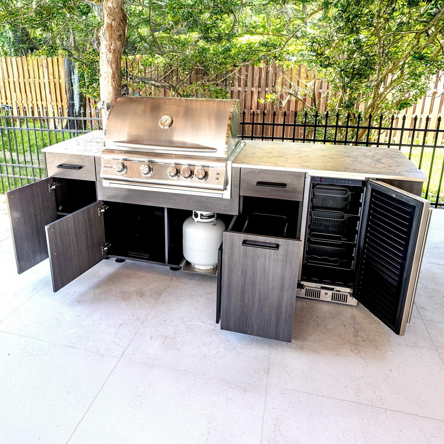 BBQGuys Signature Oasis 8 Ft Outdoor Kitchen Island w/ Blaze Propane Grill & Refrigerator in Grey Cedar/Icecap White - Open - Lifestyle thumbnail