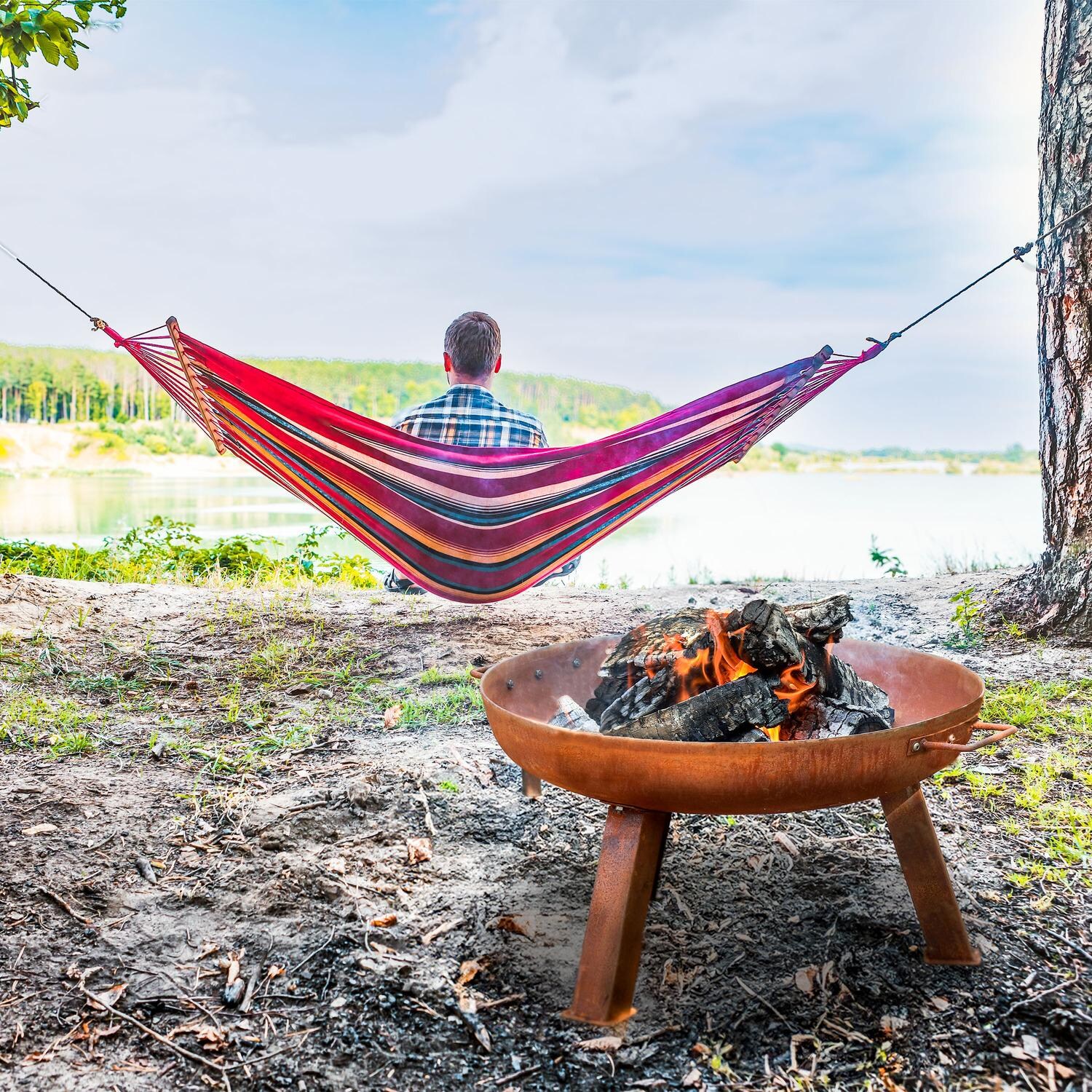 Ultimate Patio RCM-LG620 24 Inch Round Cast Iron Wood-Burning Fire Pit in Rust - Lakeside Retreat - Lifestyle thumbnail
