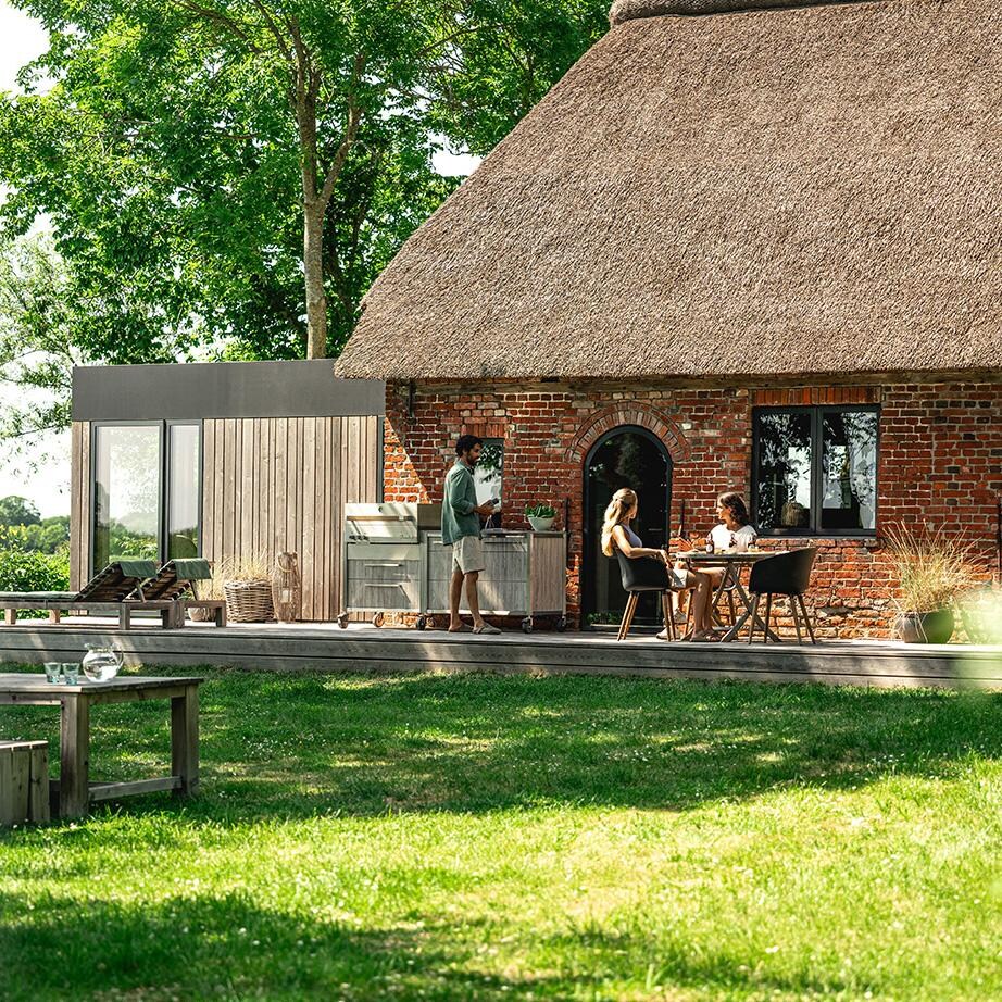 Burnout BBQ Modular Front-Lit Outdoor Kitchen Island w/ Flammkraft Model D Built-In Grill, Caso 4.4 Cu Ft. Refrigreator, Double Drawers, Propane Pullout, and Pullout Waste Bins- In Use (Shown in Oak) - Lifestyle thumbnail