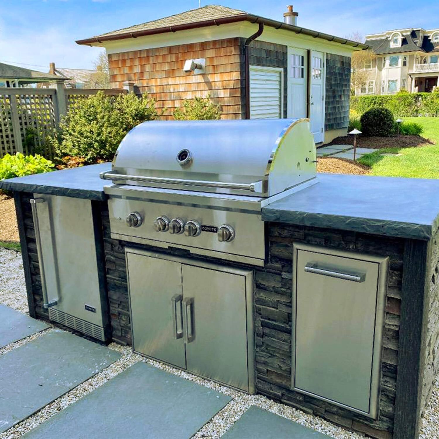 Coyote RTAC-G8-SG-C2SL36NG Ready-To-Assemble 8 Ft Outdoor Kitchen Island With 36-Inch S-Series Natural Gas Grill - Stacked Stone/Stone Gray - Lifestyle View thumbnail