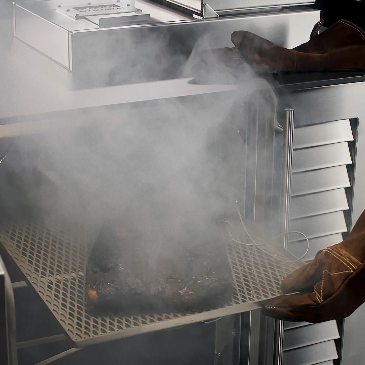 Kalamazoo K-SMOKE2-42 Freestanding Smoker Cabinet w/ Black Top - Pulling Out a Brisket thumbnail