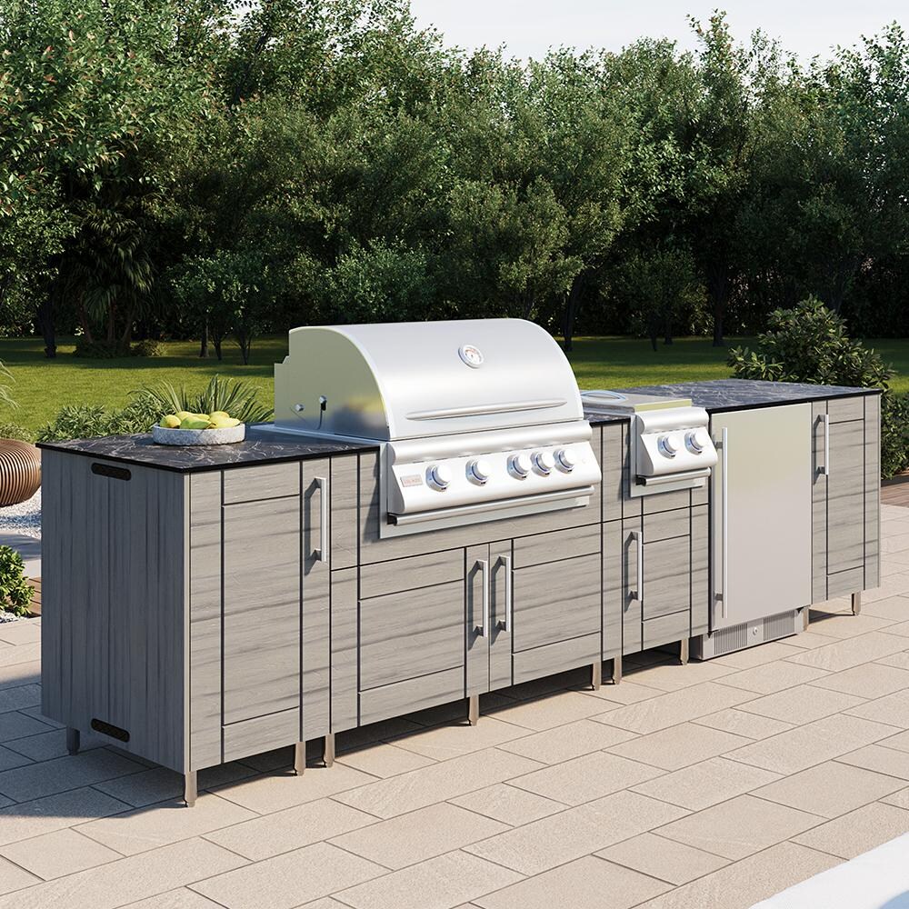 WeatherStrong Nassau 10 1/2 Ft Outdoor Kitchen Island w/ DCS Natural Gas Grill, Side Burner & Refrigerator in Dark Ash/Midnight Ice - On Patio - Lifestyle thumbnail