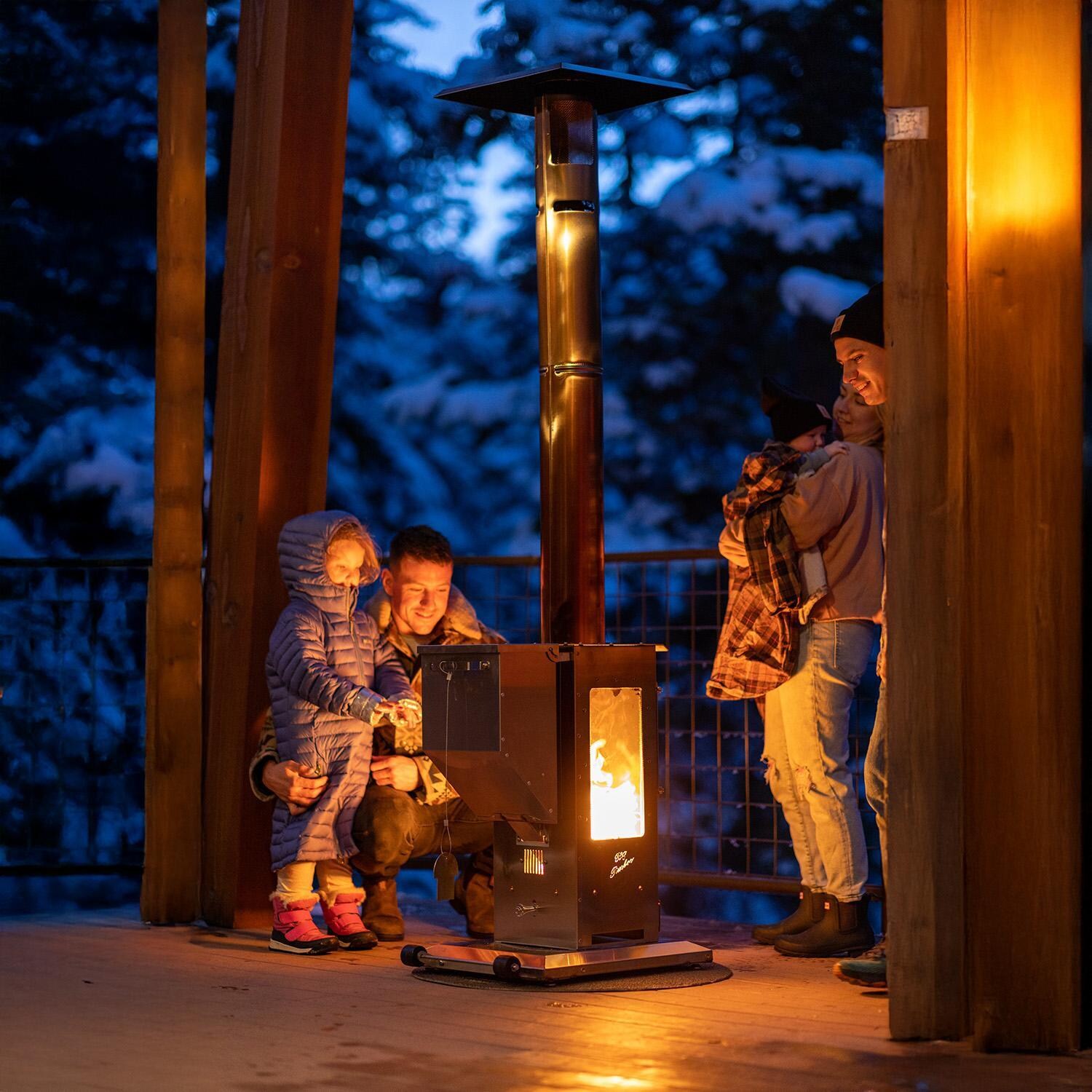 Timber Stoves Revere 22-in 90,000 BTU Pellet Freestanding Patio Heater - Stainless Steel - WPPHRSS1.0 - At Night - Lifestyle thumbnail