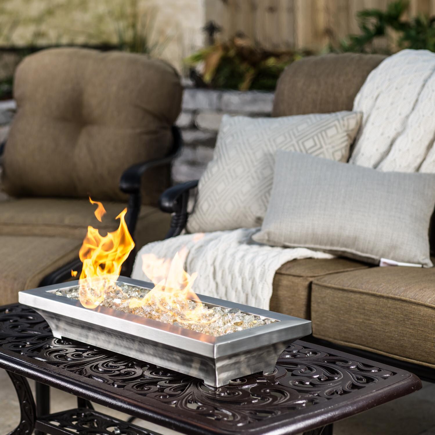 BBQGuys Signature Series Lavelle 24-Inch Table-Top Natural Gas Fire Pit - Stainless Steel - Lifestyle - Shown with 1/2 inch White Gold Reflective Fire Glass thumbnail