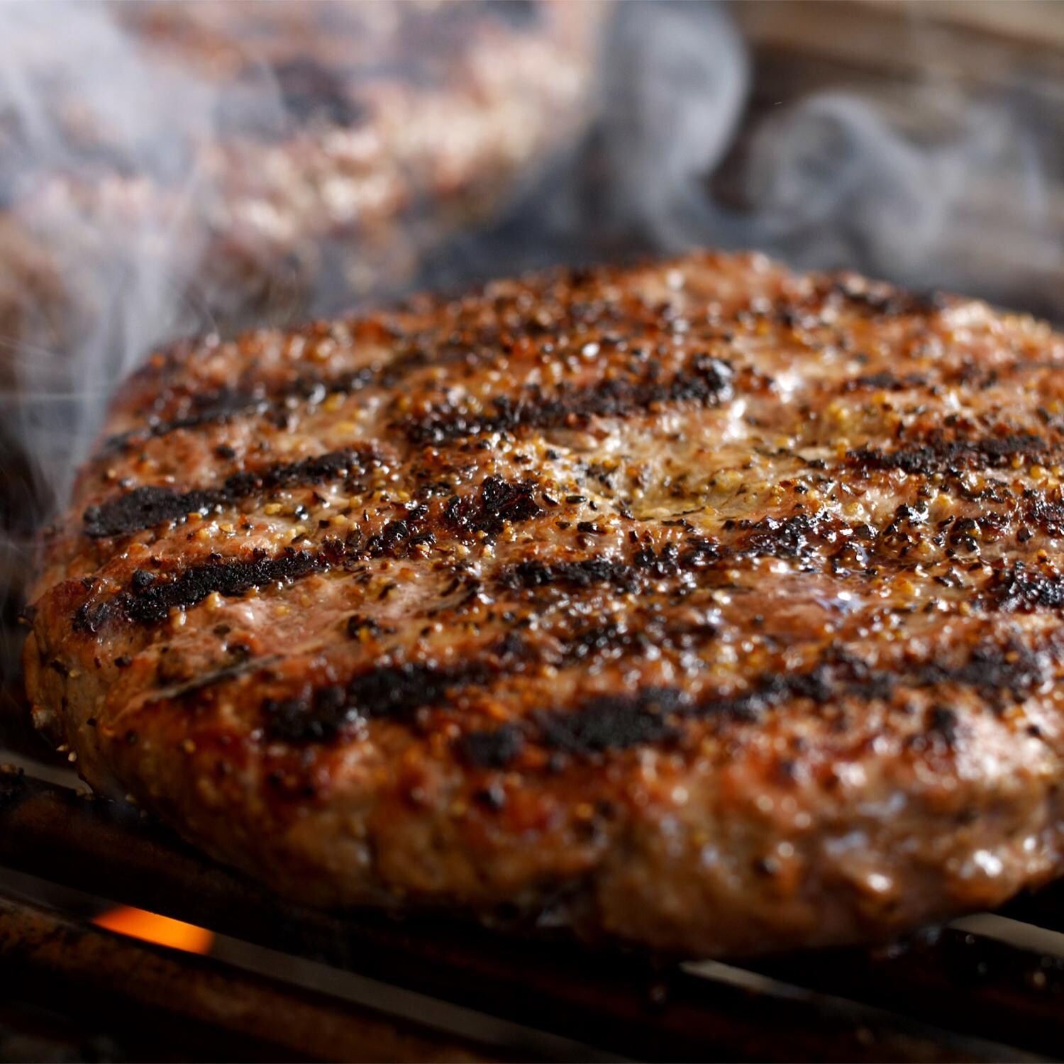 PGS T-Series T40 Commercial Cast Aluminum Propane Gas Grill With Timer On Black Patio Base - Grilling Burgers - Sear Mark Detail thumbnail