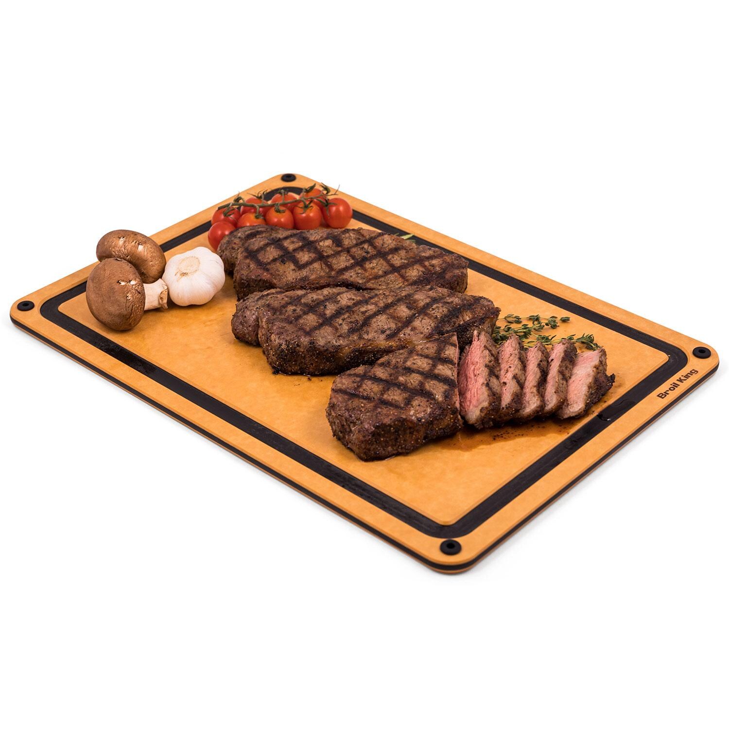 Broil King 68422 Wood Fiber Cutting Board - Ribeyes, Tomatoes, Garlic, & Onions - Right Angle - White Background thumbnail