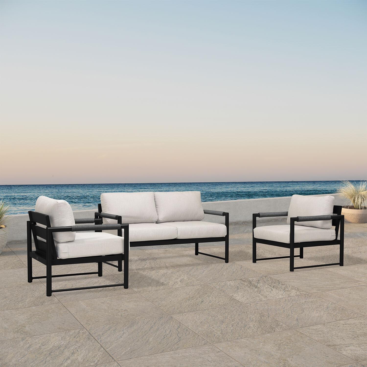 Lakeview AVEBAY-BK-CO-SET120-CS Avenue Bay Black/Carbon 3 Pc Loveseat Set - Cast Silver - Angled On Patio - Lifestyle thumbnail