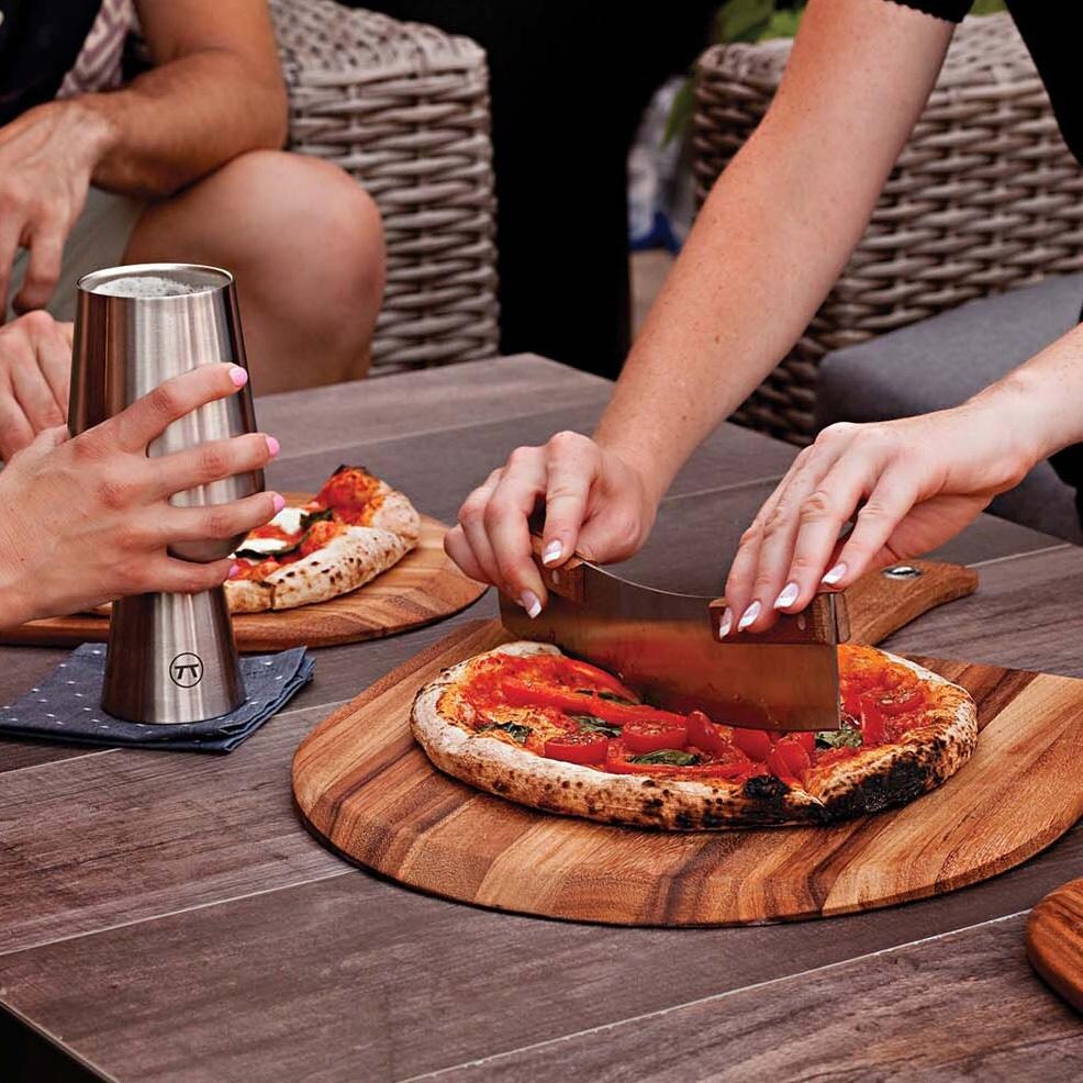 Outset  76615 Acacia Pizza Cutter - Cutting Pizza at Party - Lifestyle thumbnail
