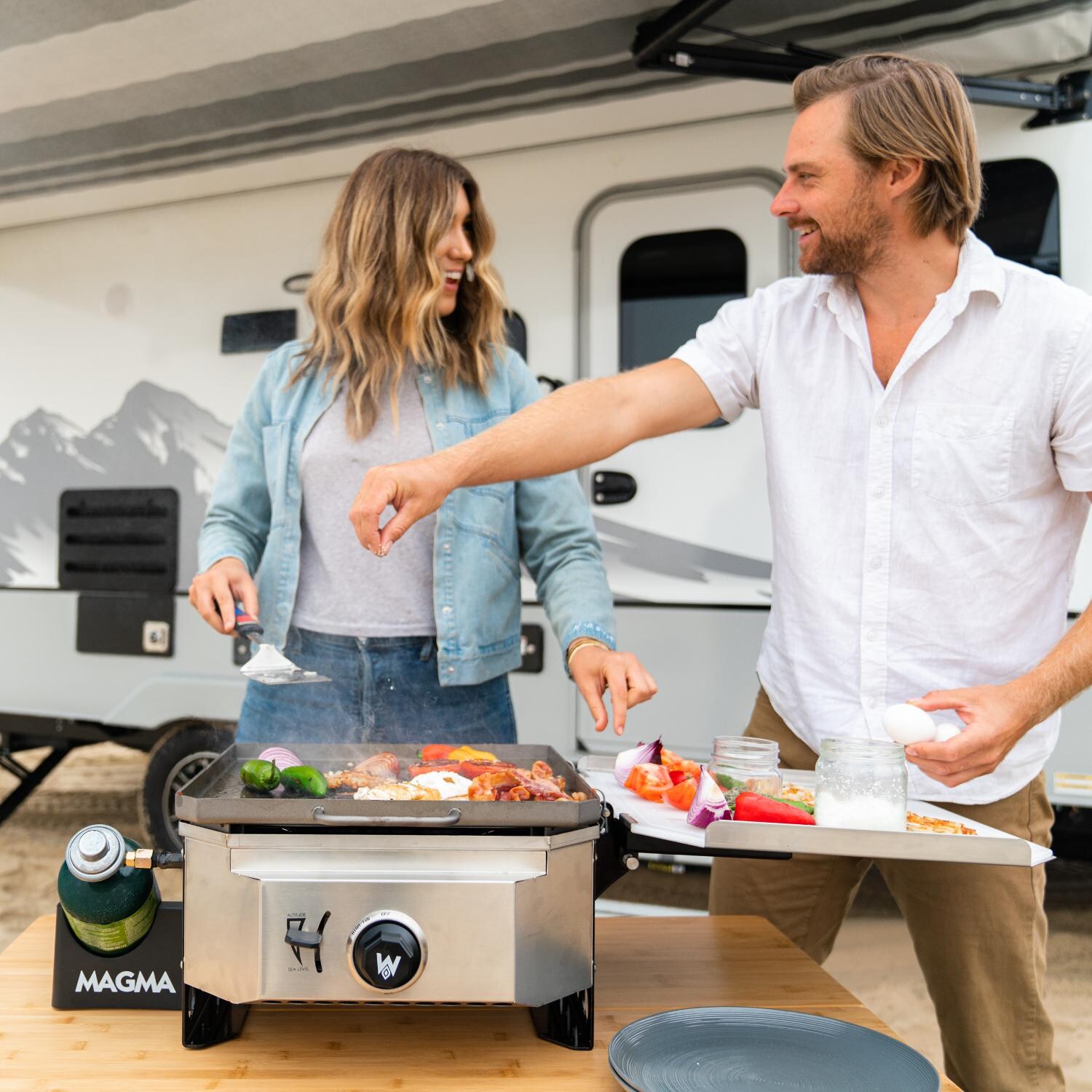 Magma Crossover Single Burner Firebox Outdoor Cooker With Plancha Topper - In Use thumbnail