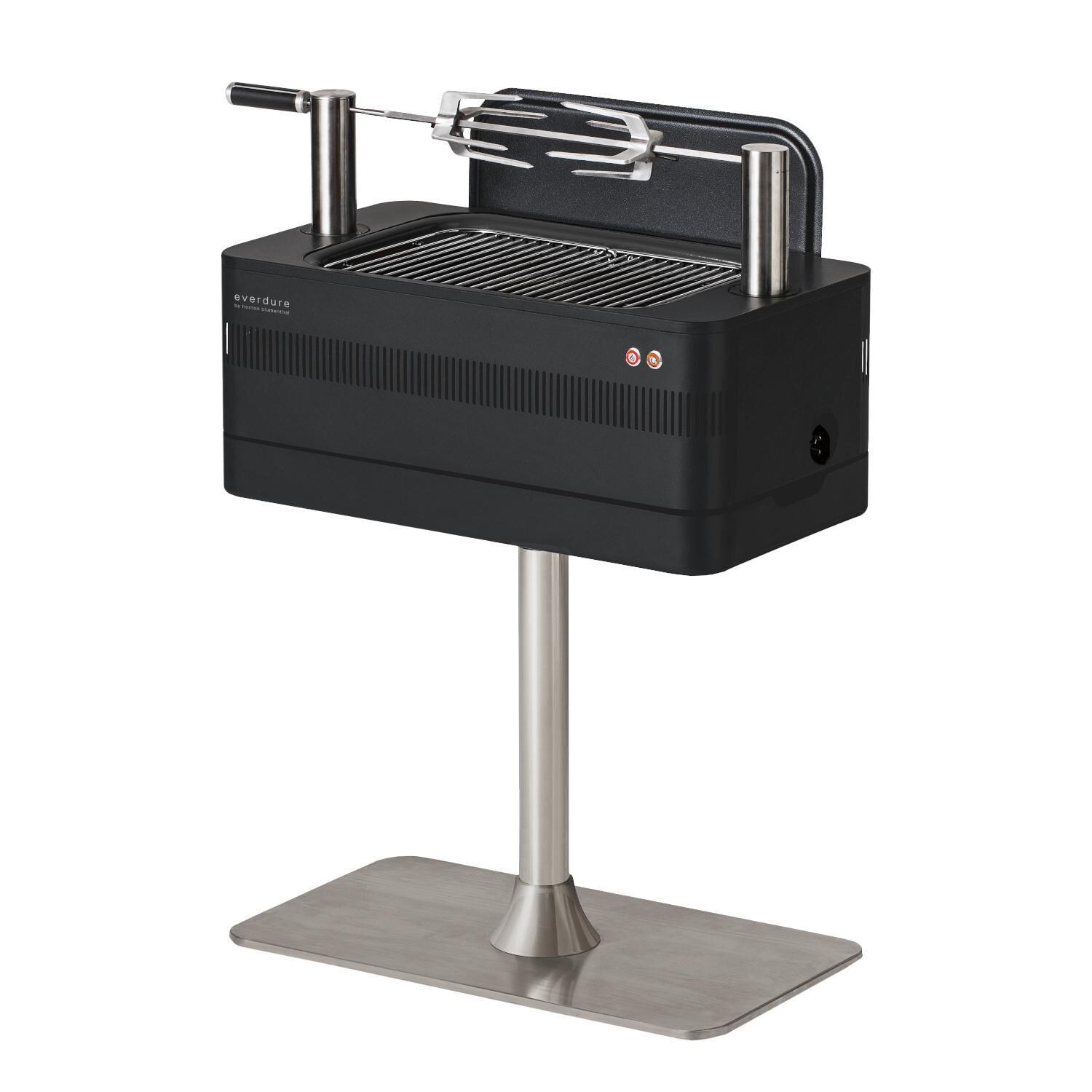 Everdure HBCE1BBSUS FUSION 29-Inch Charcoal Grill w/ Rotisserie & Electronic Ignition - Matte Black - Angled Left w/ Lid as Wind Guard - White Background thumbnail