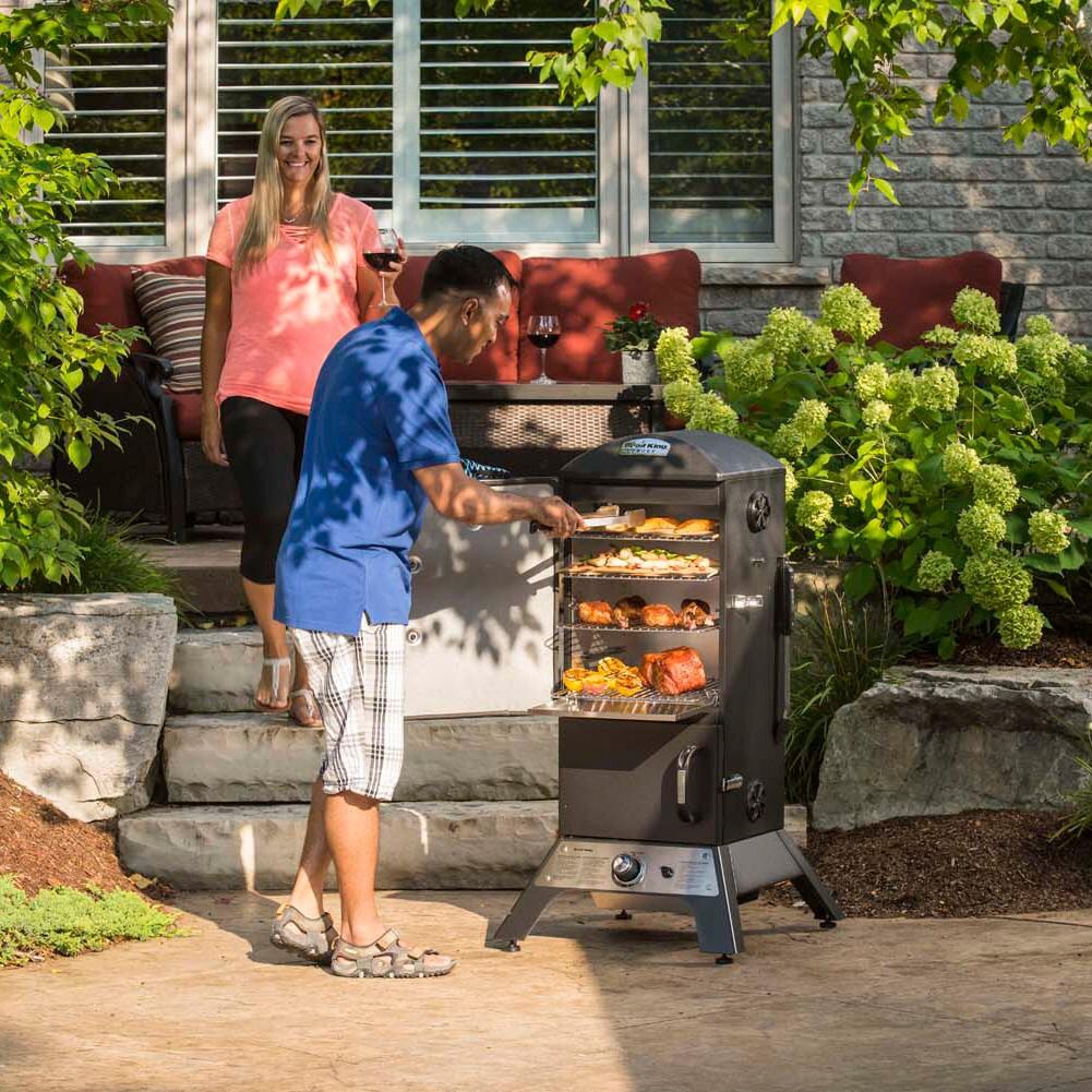 Broil King 28-Inch Smoke Vertical Propane Gas Smoker - Black - Checking Smoker - Lifestyle thumbnail