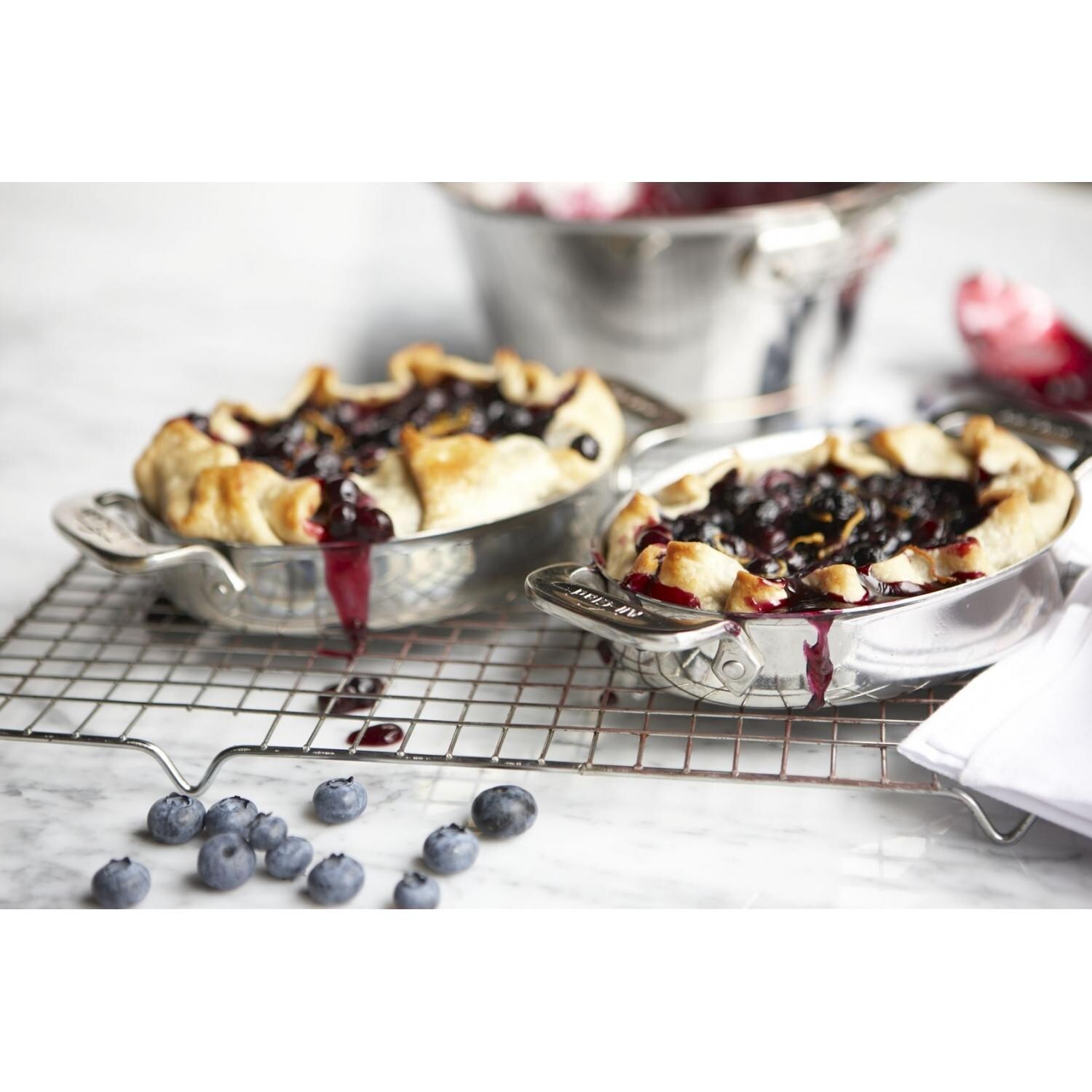 All-Clad Stainless Oval Bakers Set In Use thumbnail