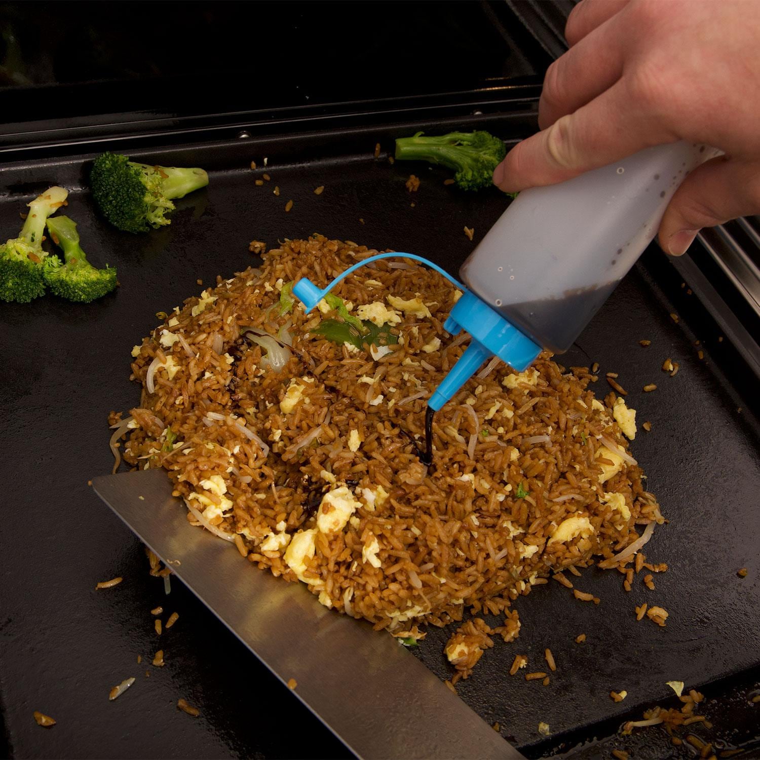 Broil King 11306 6 Pc Plancha Cooking Tool Set - Using Second Squeeze Bottle for Hashbrowns - Lifestyle thumbnail