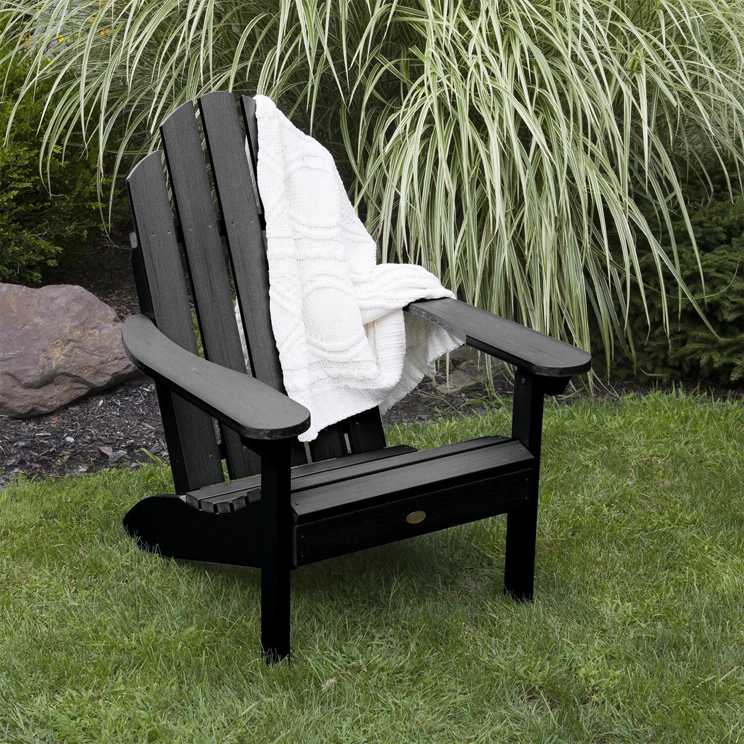 Paradise Key Recycled Plastic Adirondack Chair in Black by Lakeview Outdoor Designs - Angled View - Lifestyle thumbnail