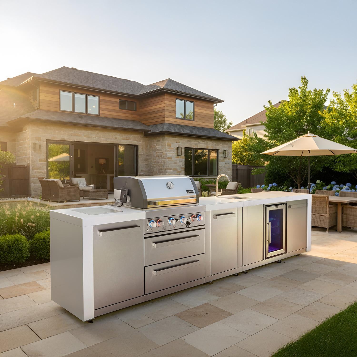 Mont Alpi Deluxe Series 12 Ft Propane Outdoor Kitchen Island w/ 32-in Grill, Side Burner, Beverage Center & Extra Door - MAi400-DBEVXL - In Front of House - Lifestyle thumbnail