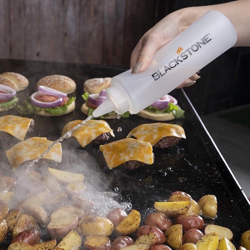 Blackstone 5230+5462 5-Piece Tool Kit & Hamburger Kit - Squeeze Bottle In Use thumbnail