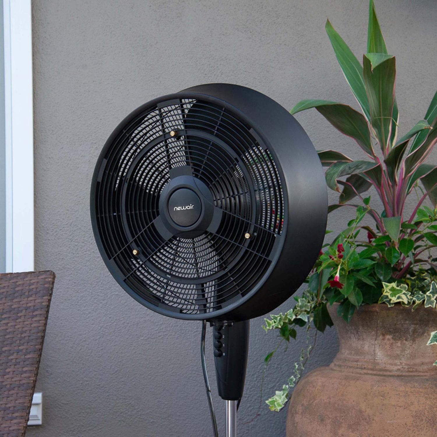 NewAir FMF2K5BK00 18-in Misting & Oscillating Pedestal Fan for Indoor & Outdoor w/ Adjustable Height & Head Tilt - 1600 CFM - On Patio - Lifestyle thumbnail