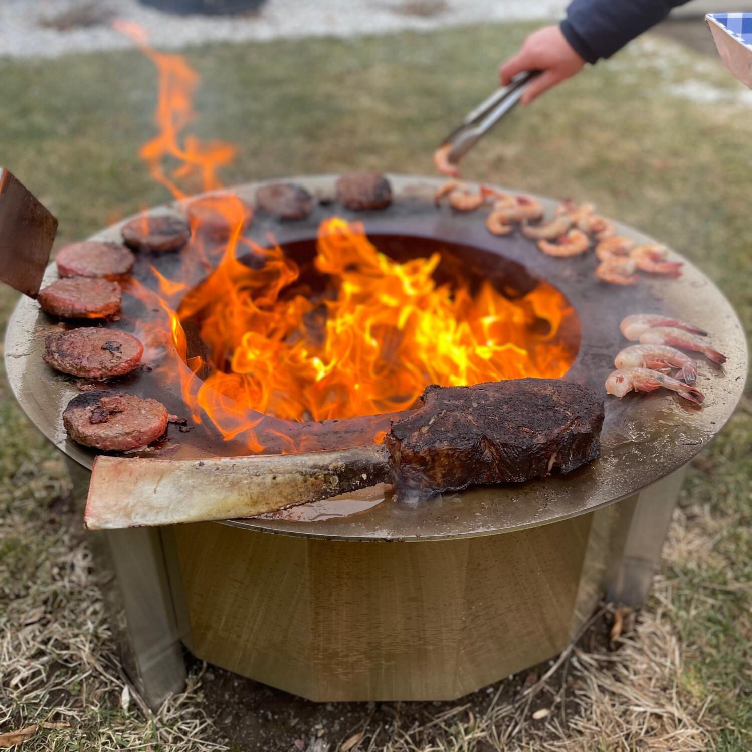 Firegear LUME-MS2SR LUME 26-Inch Round Wood Burning Sear Top Freestanding Smoke-Less Fire Pit - Cooked Food thumbnail