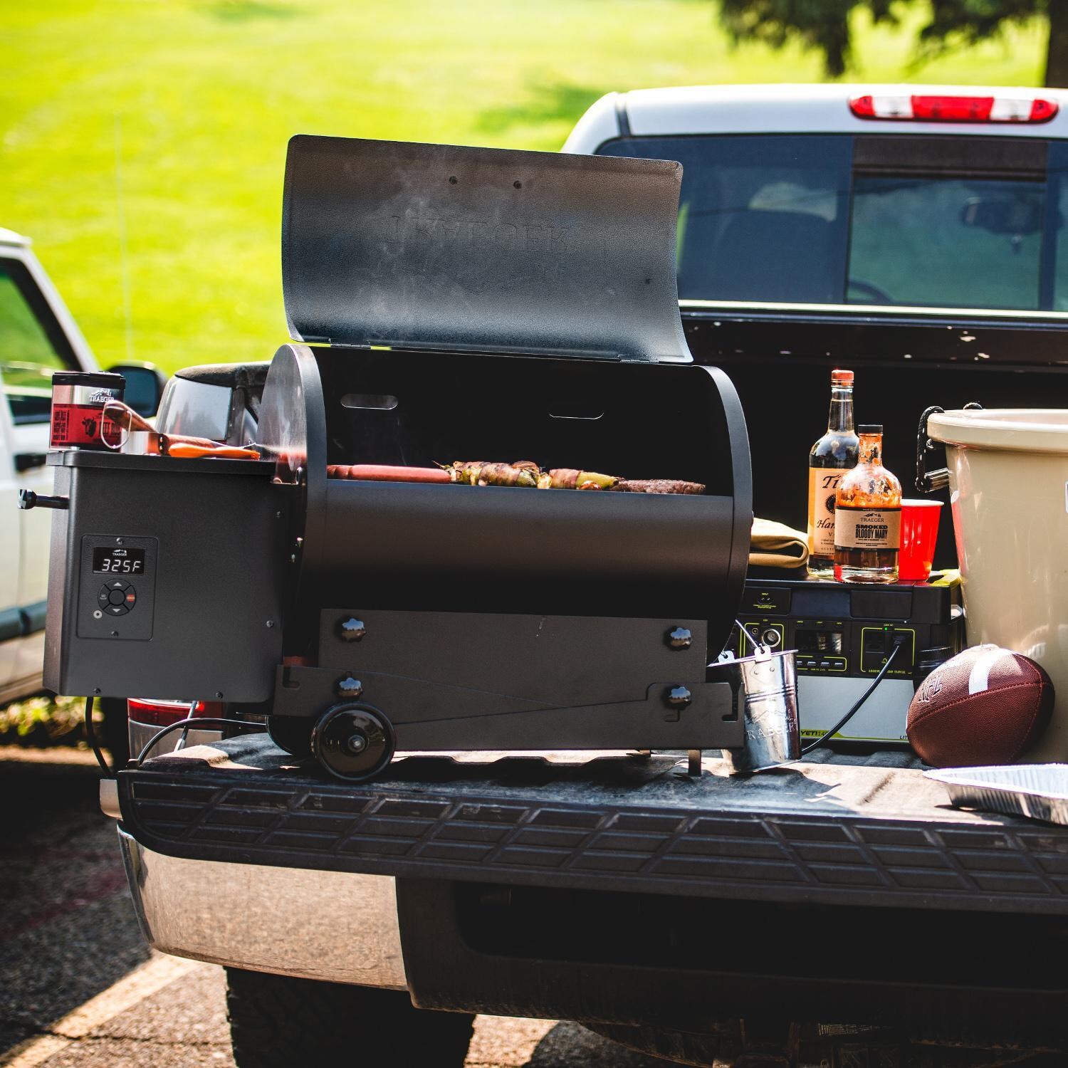 Traeger Tailgater 20 Portable Wood Pellet Grill - Black 5 Pc Bundle - Grilling in Truck Bed - Lifestyle thumbnail