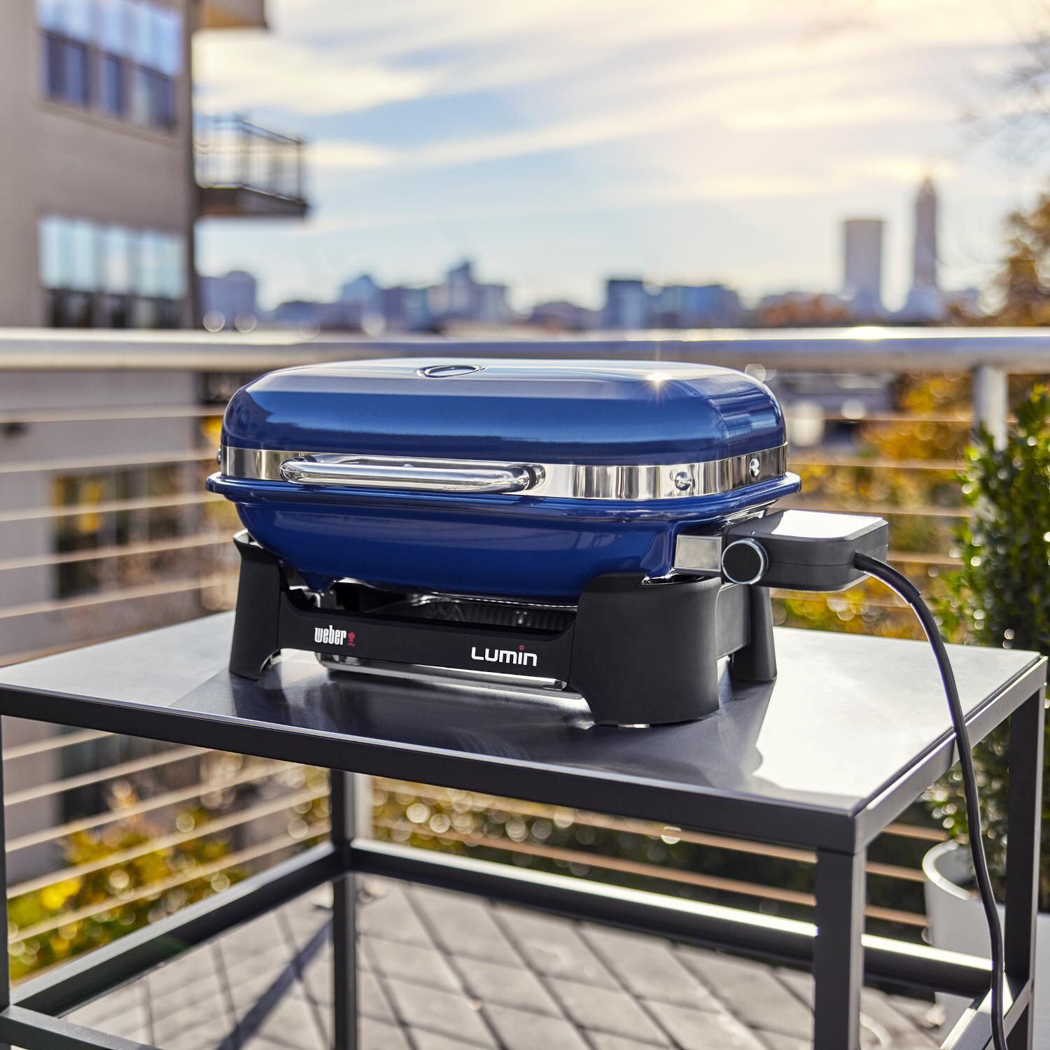 Weber 91300901 Deep Ocean Blue Lumin Compact Portable 1560 Watt Electric Grill - Outside On Table thumbnail