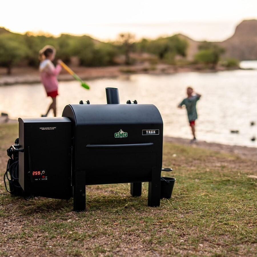 Green Mountain Grills Trek Prime 2.0 WiFi Pellet Grill - By Lake - Front - Lifestyle thumbnail