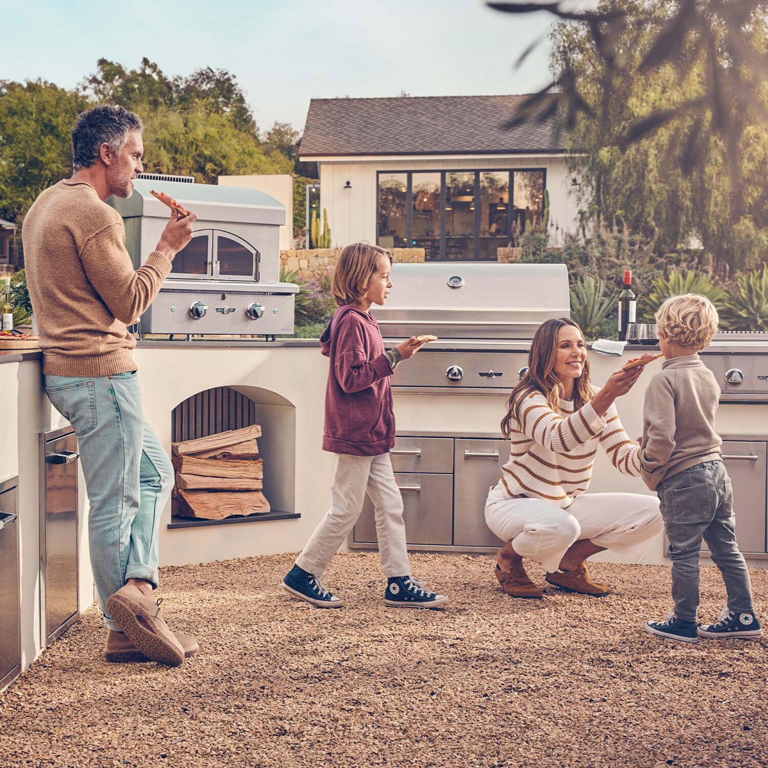 Delta Heat DHPO30F-L 30-inch Freestanding Pizza Oven Propane - Family Eating Cooked Pizza thumbnail
