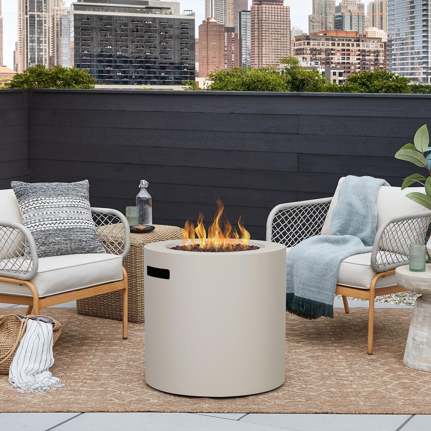 Elysian 24-in Round Steel Propane Fire Pit Table w/ Hidden Propane Tank in Light Sand by Lakeview Outdoor Designs - City Back Patio - Lifestyle thumbnail