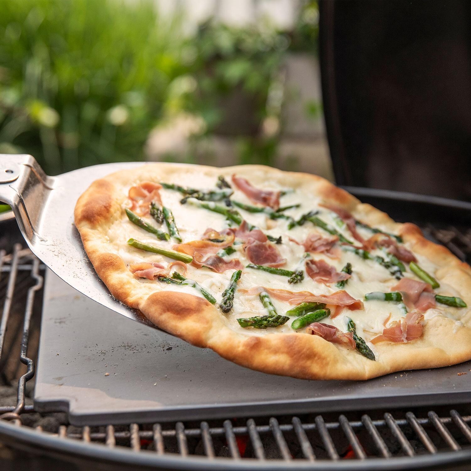 Weber 1500065 Master Touch 26-Inch Charcoal Grill With Gourmet BBQ System Cooking Grate in Smoke - Baking Pizza - Lifestyle thumbnail