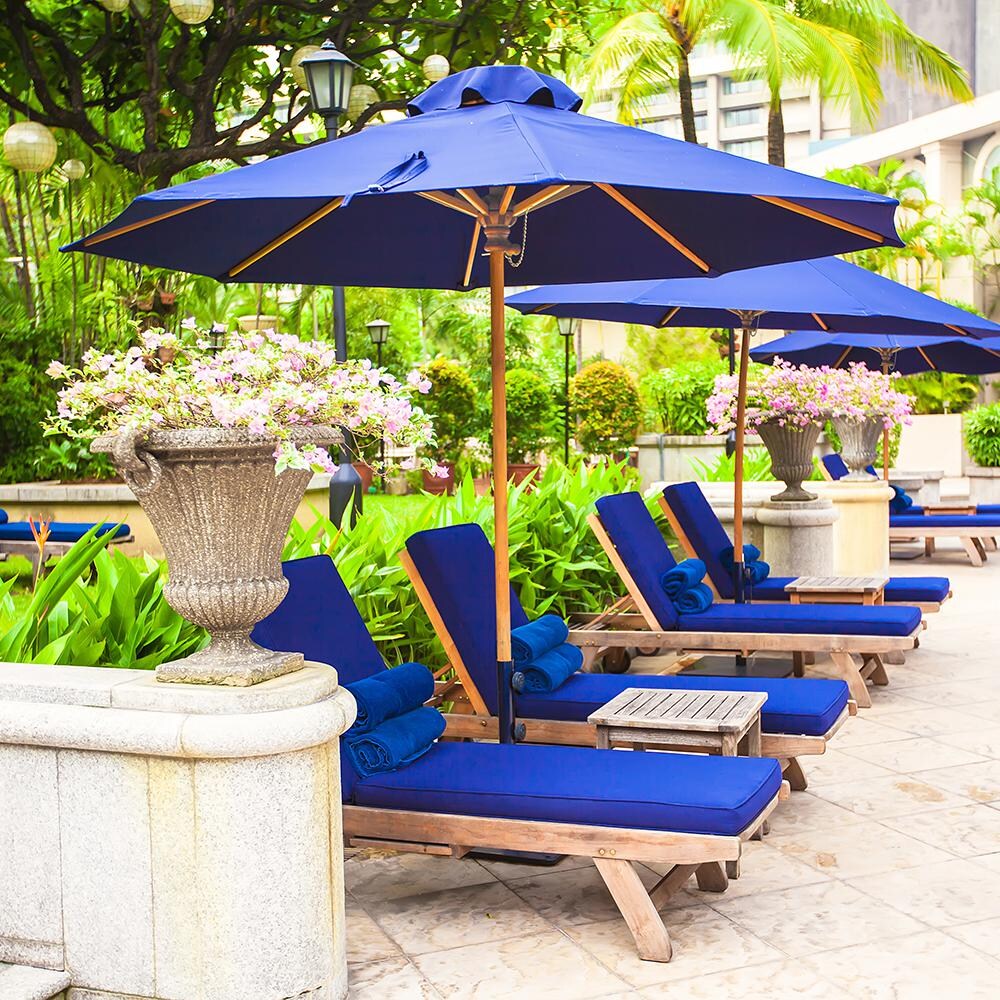 Galtech 9 Ft. Octagonal Patio Umbrella W/ Manual Lift - Lifestyle View - Shown With Navy Sunbrella Fabric (Umbrella Base Not Included) thumbnail