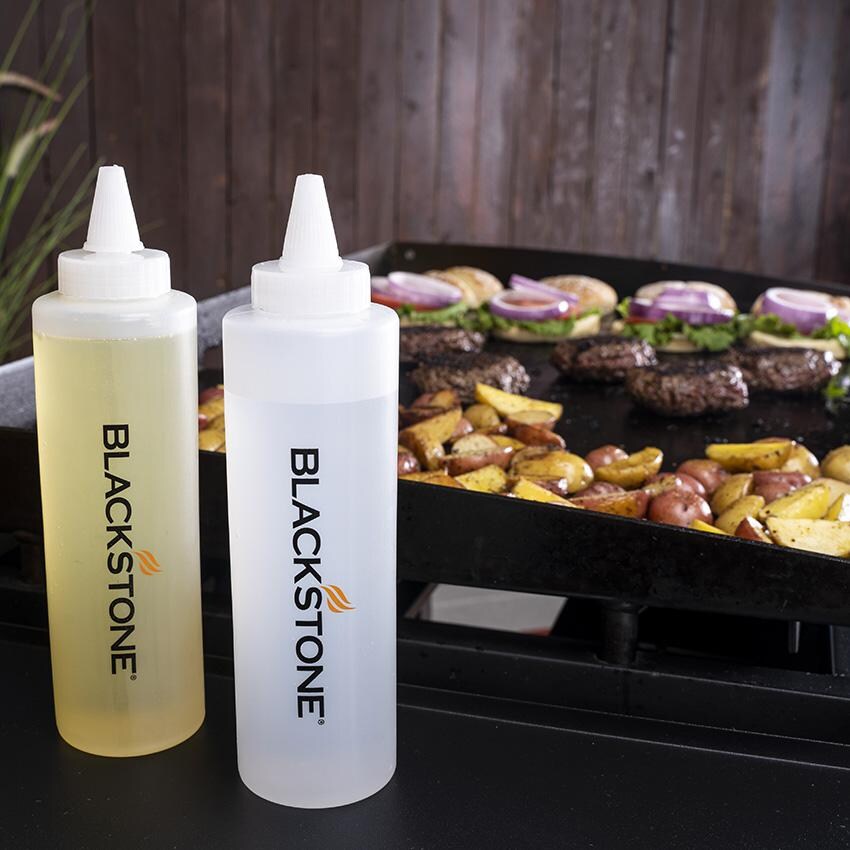 Blackstone 5230+5462 5-Piece Tool Kit & Hamburger Kit - Squeeze Bottles Pictured In Front Of Griddle thumbnail