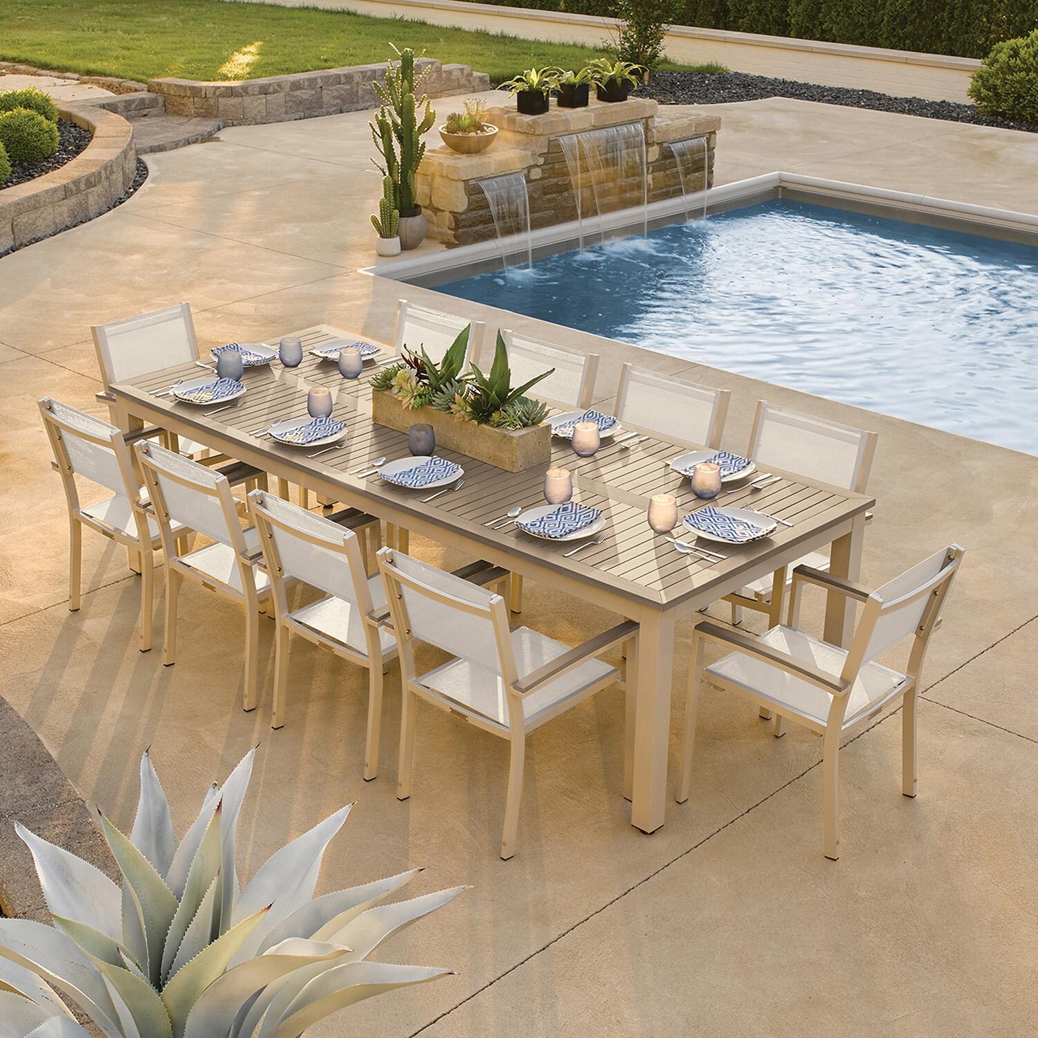 Oxford Garden 5883-PC.F Travira 11 Pc Aluminum Dining Set in Vintage Tekwood/ Natural Sling by Oxford Garden - By Pool - Lifestyle thumbnail