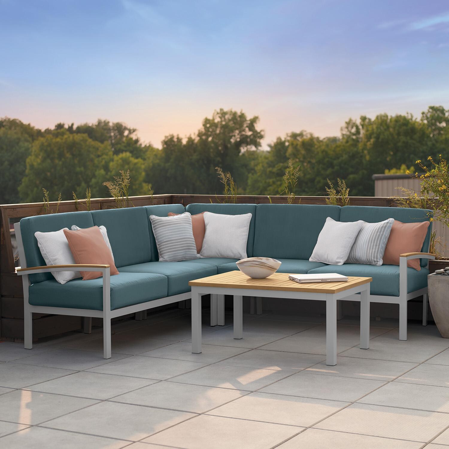 Oxford Garden 5275-PC.F Travira 4 Pc Aluminum Seating Set w/ Coffee Table in Natural Tekwood/ Ice Blue by Oxford Garden - On Patio - Lifestyle thumbnail