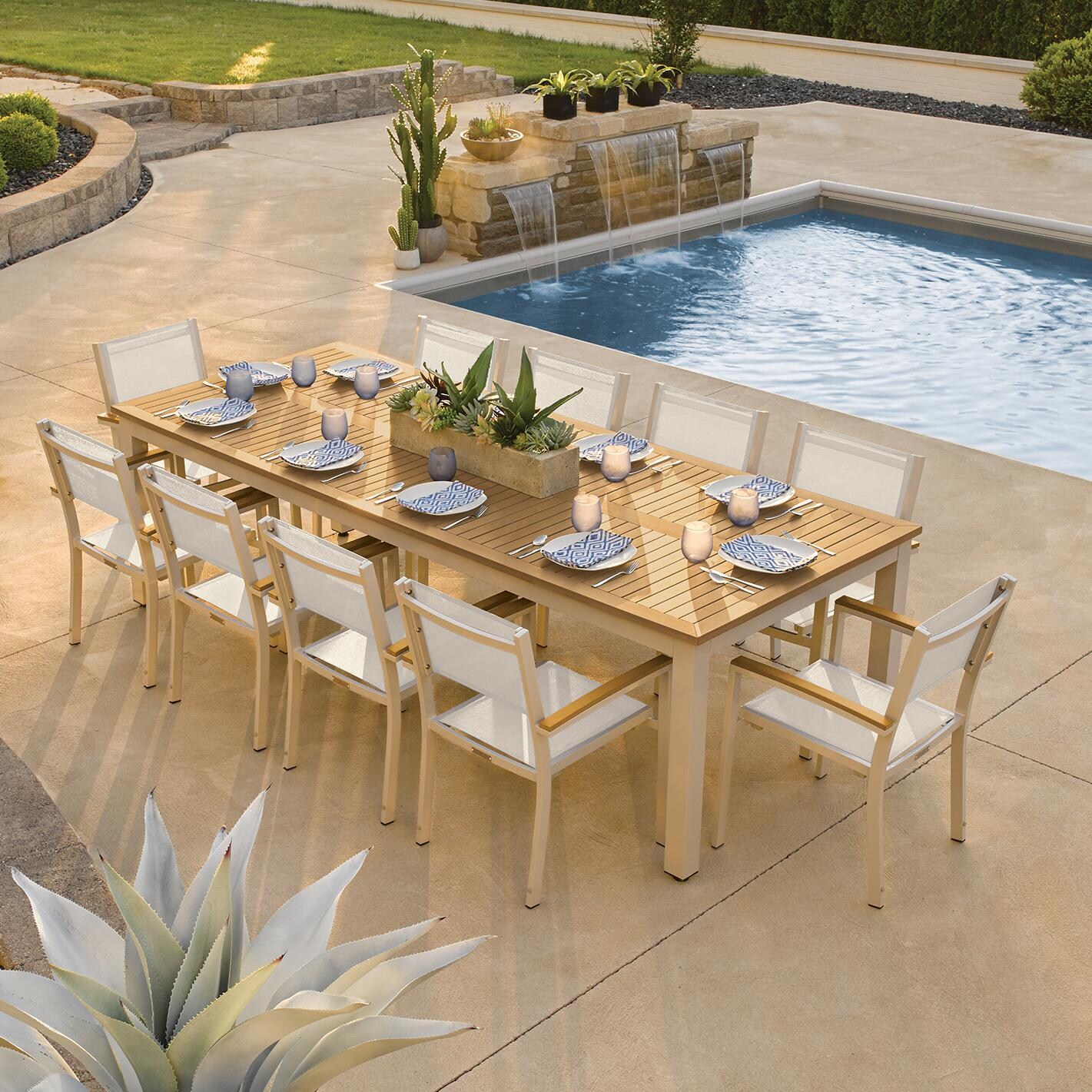Travira 11 Piece Aluminum Patio Dining Set W/ 103 X 42 Inch Table and Tekwood Natural Tabletop By Oxford Garden - On The Patio thumbnail
