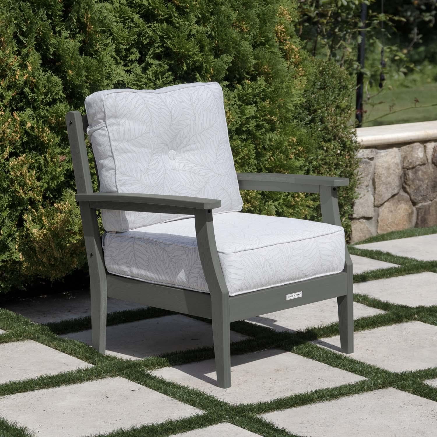 Blushing Bay Recycled Plastic Club Chair in Lively Parchment/Coastal Teak by Lakeview Outdoor Designs - On Patio - Lifestyle thumbnail