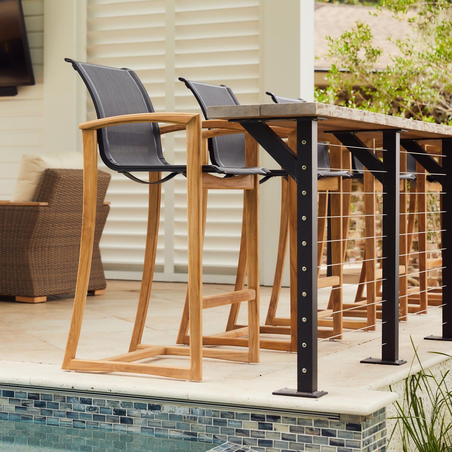 Teak + Table Capri Sling Bar Chair in Black - Lifestyle thumbnail